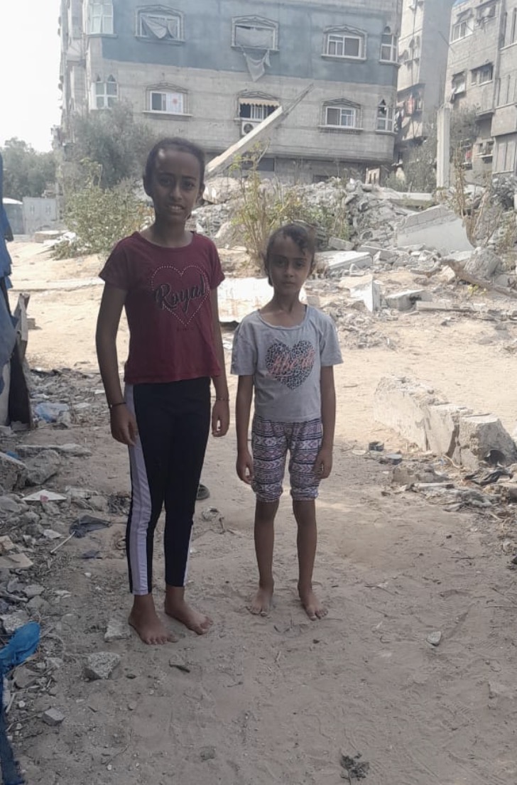 Maha and Sama in Gaza, among the rubble